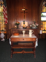 A photo of the altar display of the Spirit Congregational Communion Pottery set by Ocepek Pottery in Akron, Ohio. Photo courtesy of  Kingsley United Methodist Church, Kingsley, Mi., 
Photographer Tim Goldsmith