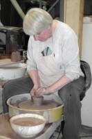 A photo of Debra Ocepek at the potter's wheel, Akron, Ohio