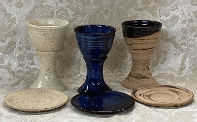 photo of 1st communion pottery set in cream, blue and memorial, made by Debra Ocepek of Ocepek Pottery Communionware