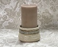 photo of stoneware cup with candle